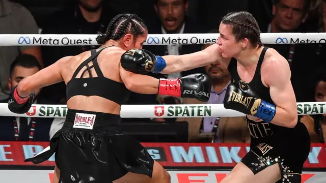 Amanda Serrano is punched by Katie Taylor