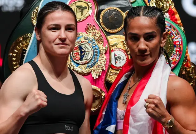 Katie Taylor and Amanda Serrano hold up their fist