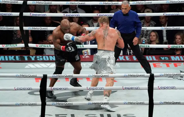 Jake Paul punches Mike Tyson