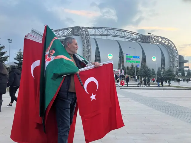 Man selling merchandise outside the stadium