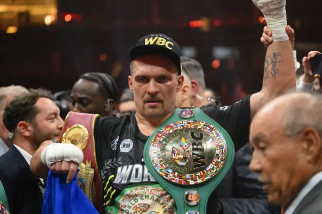 Oleksandr Usyk with WBC belts