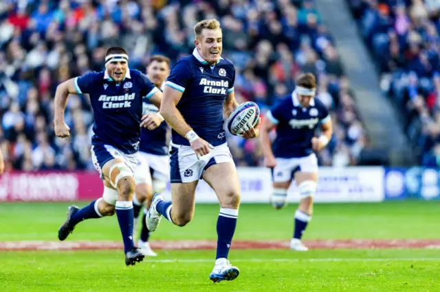 Stafford McDowall scurries over for a try as Scotland captain