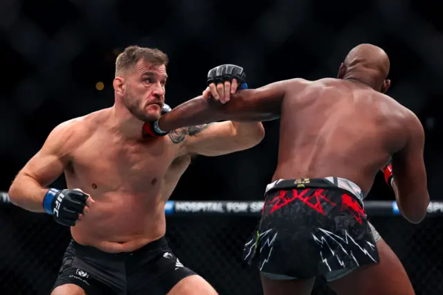 Stipe Miocic slips a punch from Jon Jones