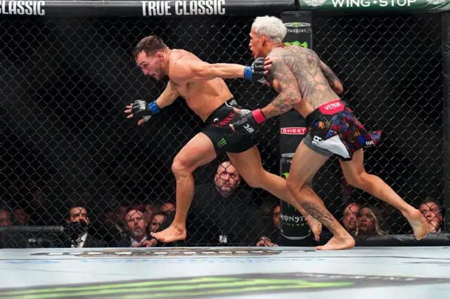 Michael Chandler runs from Charles Oliveira