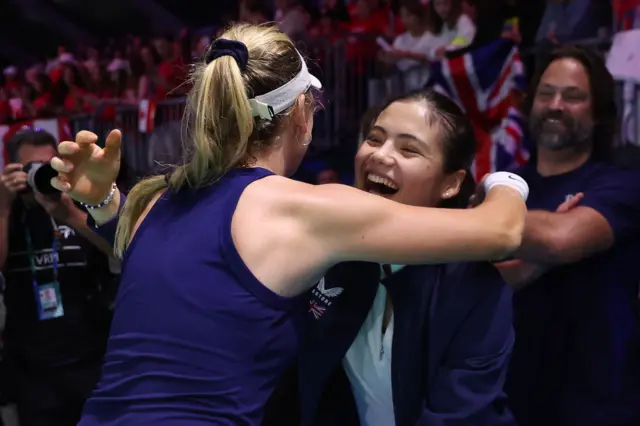 Katie Boulter of Great Britain embraces Emma Raducanu of Great Britain