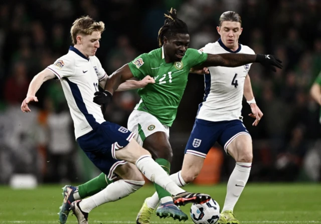 Republic of Ireland's Festy Ebosele in action with England's Anthony Gordon and Conor Gallagher