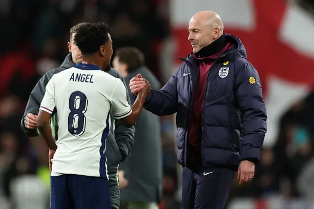 Angel Gomes shakes hands with England's interim manager Lee Carsley