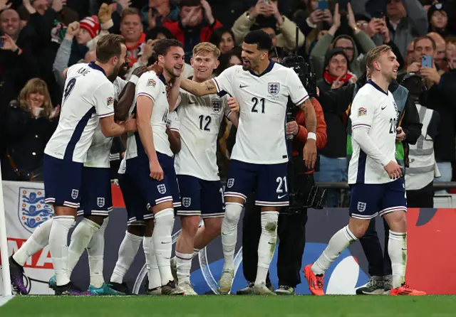 Taylor Harwood-Bellis of England celebrates scoring his team's fifth goal with teammates