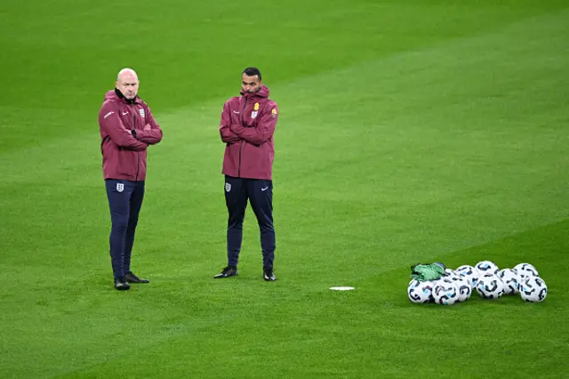 Lee Carsley, Interim Head Coach of England, and Ashley Cole, Interim Assistant Coach of England, look on