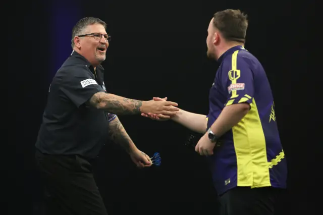 Gary Anderson and Luke Littler shake hands