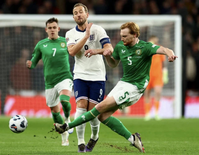 Republic of Ireland's Liam Scales in action with England's Harry Kane