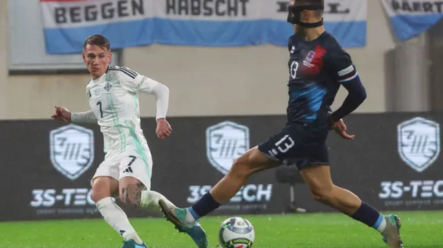 Northern Ireland's Ethan Galbraith sends in a cross at the Stade de Luxembourg