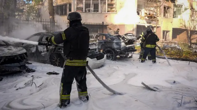 Firefighters work at the site where a residential area was hit by a Russian missile strike, amid Russia's attack on Ukraine, in Odesa