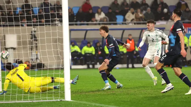 Conor Bradley watches his header go into the net to make it 2-0