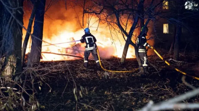 Firefighter battling flames