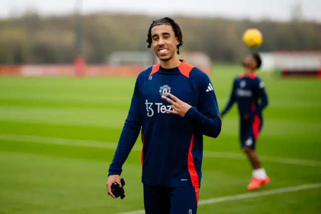 Leny Yoro poses after Manchester United training