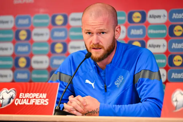 Aron Gunnarsson speaks to the media