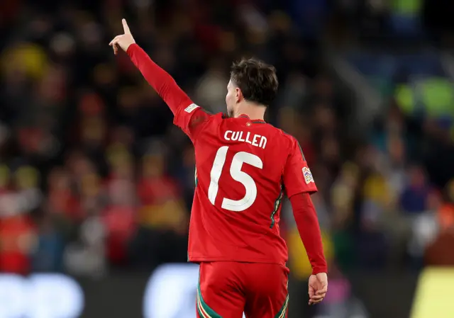 Wales striker Liam Cullen celebrates