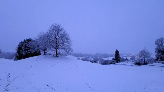 Morning walkers have made their footprints in the snow in Leek Wootton, Warwickshire