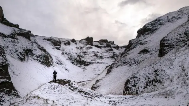 Walkers on Winnats Pass in the Peak District, Derbyshire