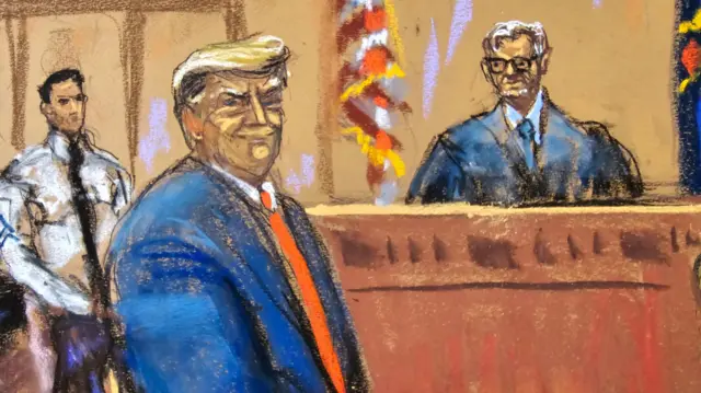 Donald Trump smiles to the jury pool as he is introduced to them, at the beginning of his trial before Justice Juan Merchan over charges that he falsified business records