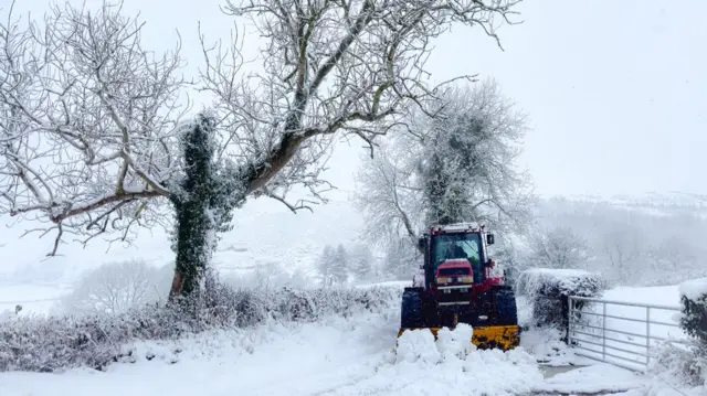 Work is under way to clear snow from the hills above Ruthin in Denbighshire, Wales