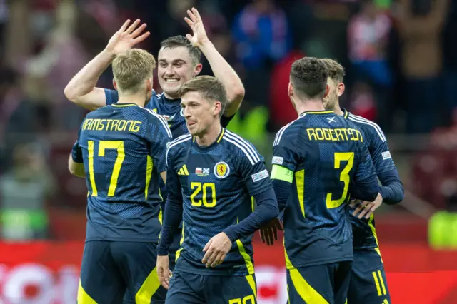 Scotland's players celebrate after beating Poland