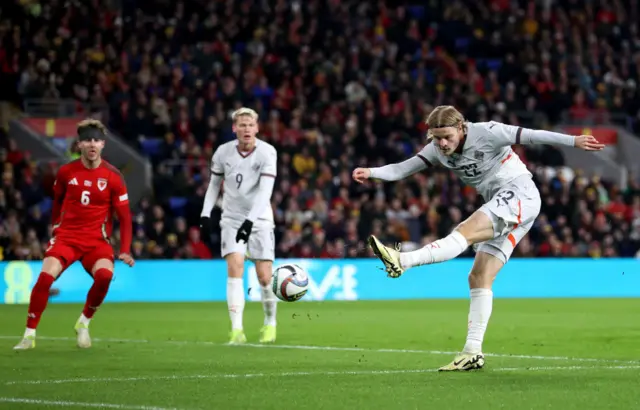 Andri Gudjohnsen of Iceland scores