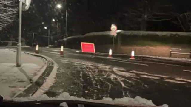 Grane Road in Haslingden covered with snow has a red road closed sign