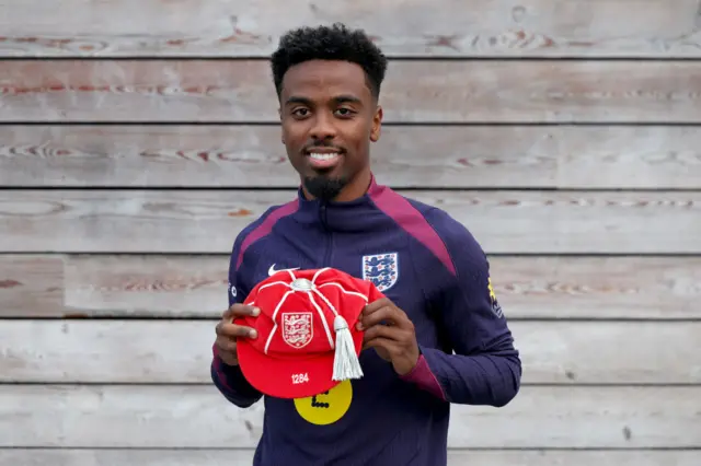 Angel Gomes with his England cap at St George's Park