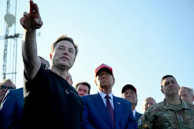 Elon Musk speaks with U.S. President-elect Donald Trump and guests at a viewing of the launch of the sixth test flight of the SpaceX Starship rocket