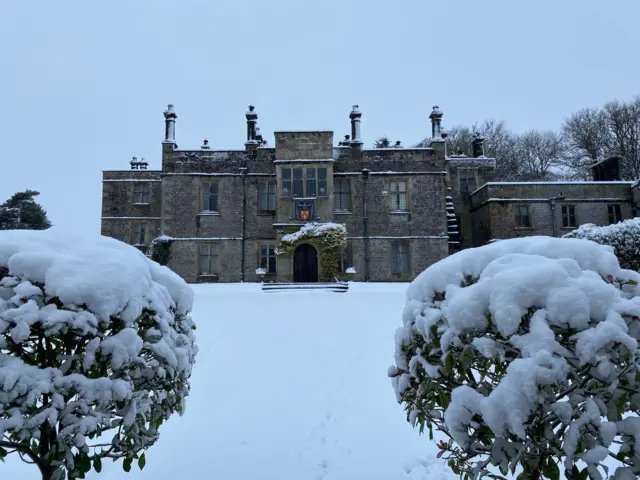 Tissington is pictured in the snow, with snow also covering hedges