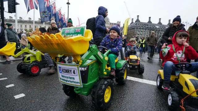 Children on toy tractors during a farmers protest in central London over the changes to inheritance tax (IHT) r