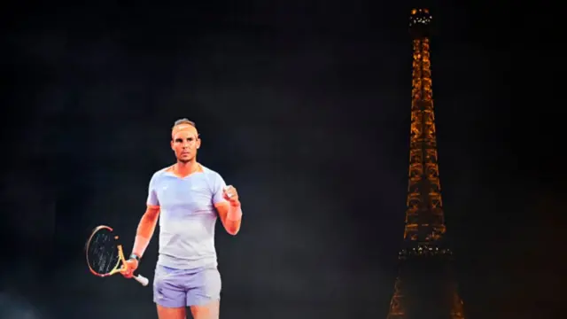 A projection showing Spanish tennis player Rafael Nadal with the Eiffel Tower in the background