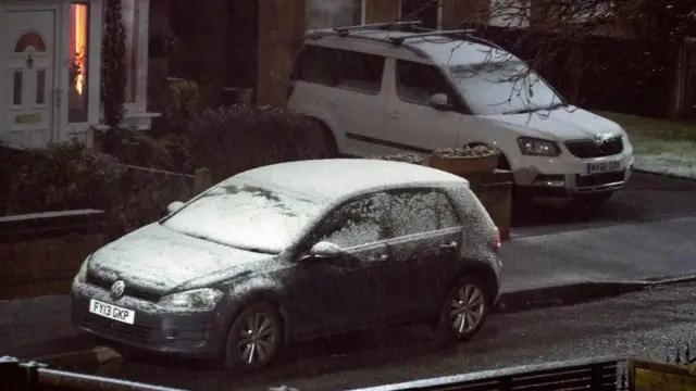 Snow begins to fall on a car in Lee Park Liverpool