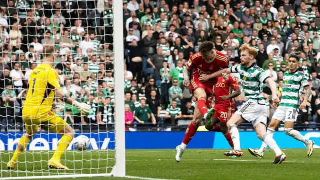 Aberdeen’s Angus MacDonald scores to make it 3-3 during a Scottish Gas Scottish Cup semi-final match between Aberdeen and Celtic at Hampden Park, on April 20, 2024.