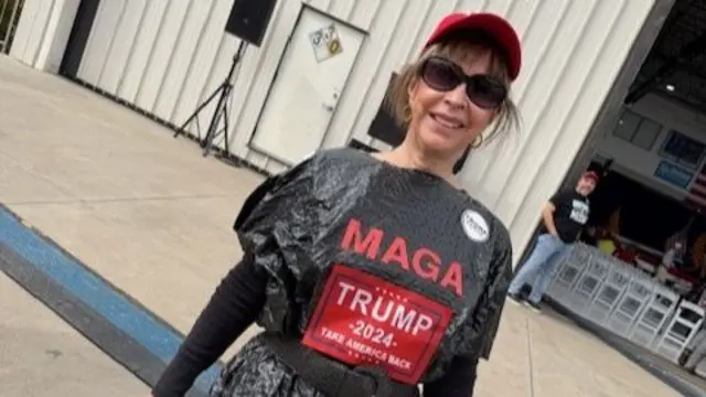 Janet Szafranski wearing a bin liner with 'MAGA' and 'Trump 2024 Take America Back' written on it