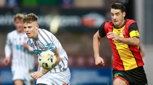 Dunfermline Athletic's Sam Young and Partick Thistle's Brian Graham