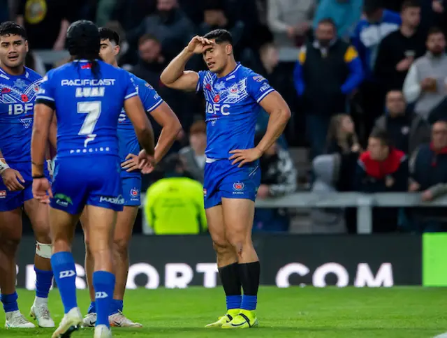 Samoa's Roger Tuivasa-Sheck dejected as his side allow England another try.