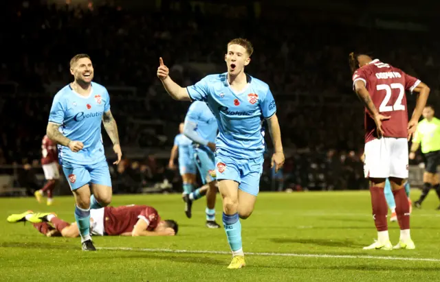 Luca Miller celebrates scoring for Kettering