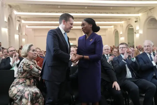 Kemi Badenoch and Robert Jenrick shaking hands