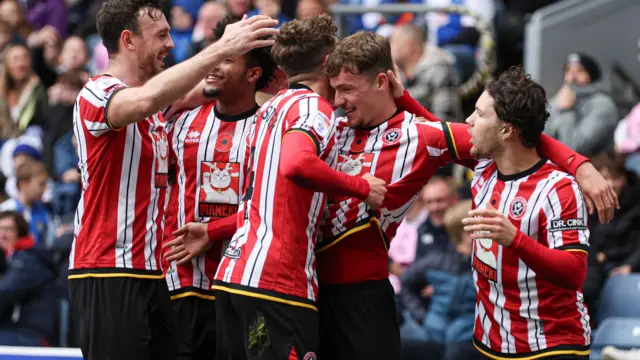 Sheffield United players celebrate after Harrison Burrows' goal at Blackburn