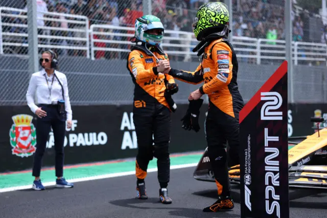 Oscar Piastri and Lando Norris shake hands