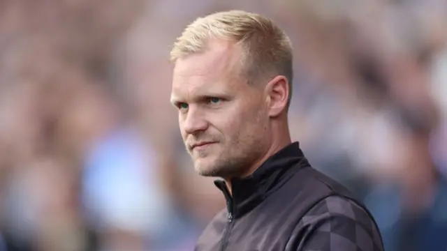 Liam Manning watching Bristol City