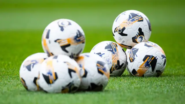 Footballs on St Johnstone's McDiarmid Park pitch