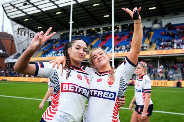 Brown of England and Paige Travis of England celebrates their teams victory over Wales