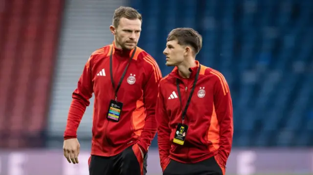 GLASGOW, SCOTLAND - NOVEMBER 02: Aberdeen's Nicky Devlin (L) and Leighton Clarkson arrive ahead of a Premier Sports Cup semi-final match between Celtic and Aberdeen at Hampden Park, on November 02, 2024, in Glasgow, Scotland. (Photo by Alan Harvey / SNS Group)