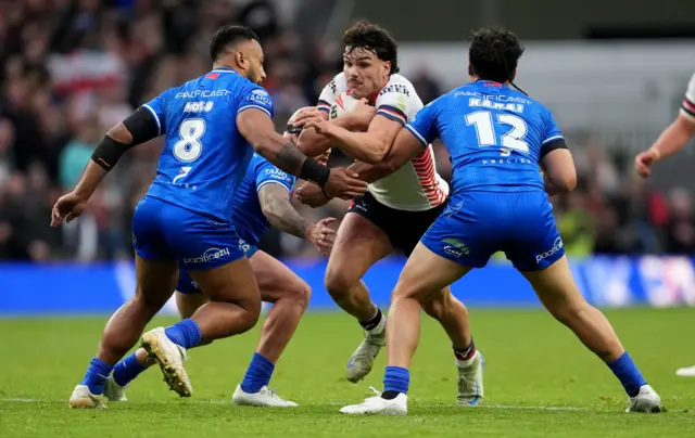 Herbie Farnworth is tackled by Samoa's Francis Molo