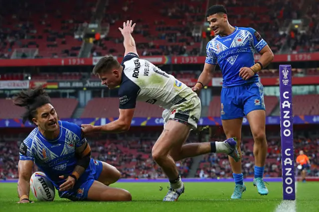 Tim Lafai of Samoa touches down for their team's first try