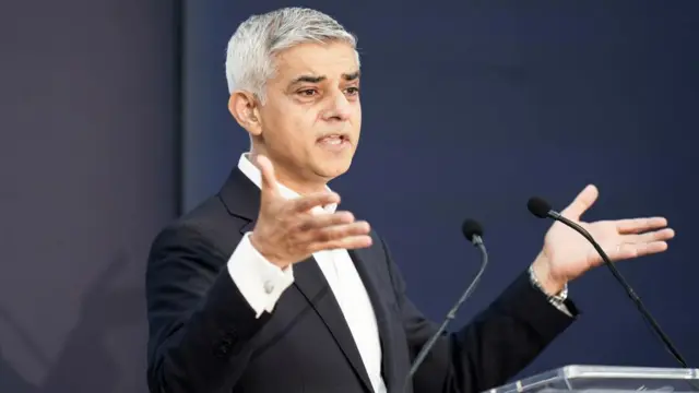 Sadiq Khan delivers a speech from a lectern